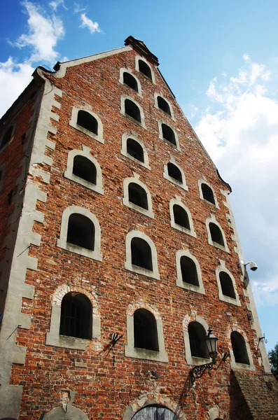 Old brick granary and blue sky — Stock Photo, Image