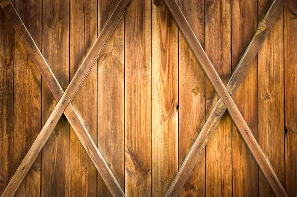 Деревянная дверь с двумя крестами — стоковое фото