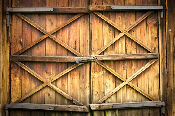 Holztür mit vier Kreuzen — Stockfoto