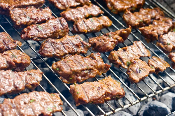 Traditional Croatian cevapcici on the grill — Stock Photo, Image