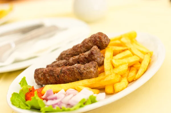 Cevapcici with chips — Stock Photo, Image