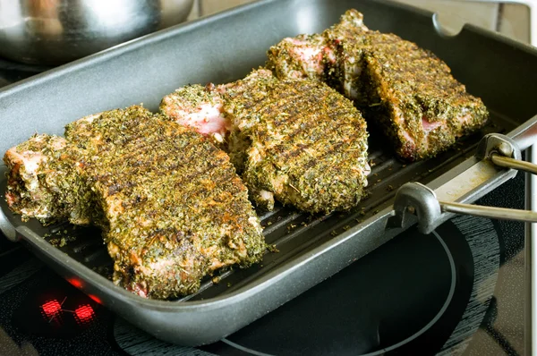 Pork chop with marjoram on the grill pan — Stock Photo, Image