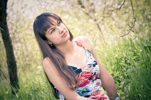 Young attractive girl in the garden — Stock Photo, Image