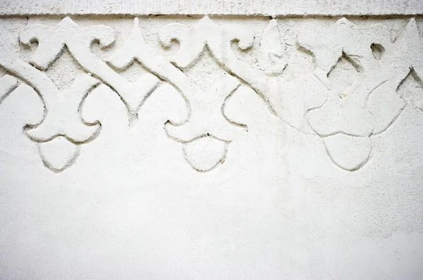 Concrete wall with ornament — Stock Photo, Image