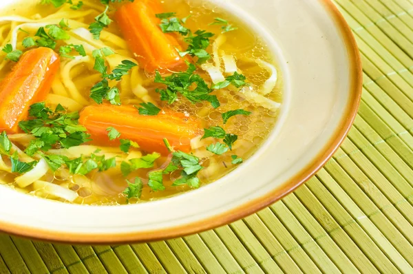 Fresh broth with carrot and parsley — Stock Photo, Image