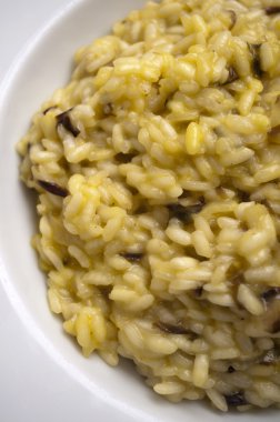 Italian risotto with porcini mushrooms radicchio and cheese clipart