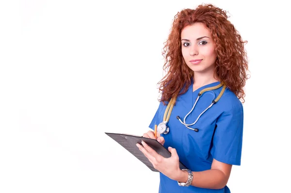 Ženský lékař drží schránky a usmívá se — Stock fotografie