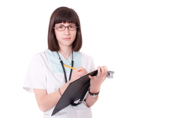 Female doctor holding clipboard and smiling — Stock Photo, Image