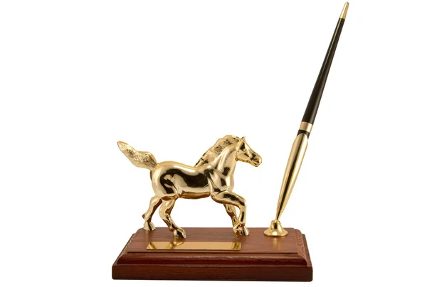 stock image Figurine of a gold horse separately on a white background