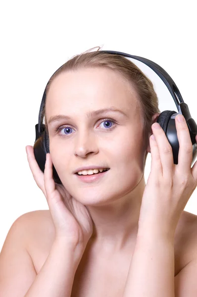 Menina sorridente com fones de ouvido — Fotografia de Stock