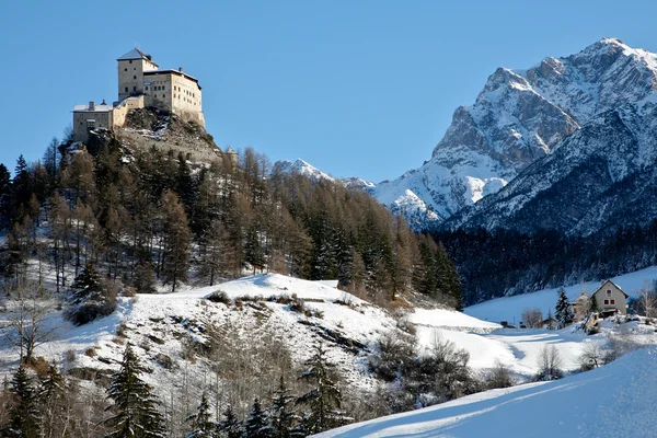 stock image Tarasp Switzerland village in the winter with a castle