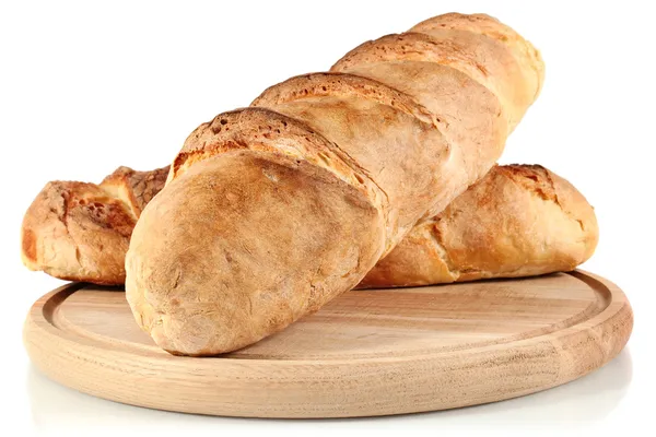 Pan casero sobre tabla de pan de madera —  Fotos de Stock