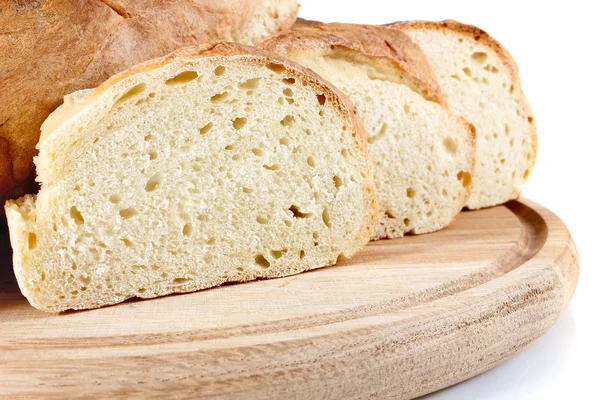 Homemade bread on wooden breadboard — Stock Photo, Image