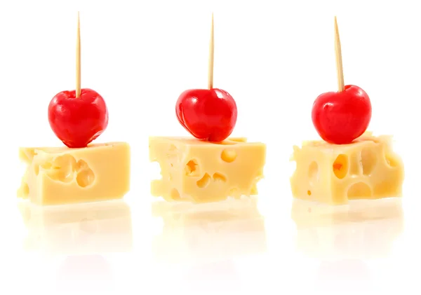 Piece cheese with cocktail cherry — Stock Photo, Image