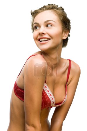 Belle femme souriante dans un soutien-gorge rouge .