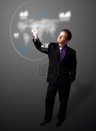 Homme d'affaires appuyant sur le type high tech de boutons modernes