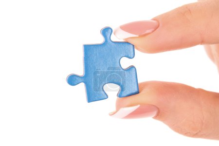 Main avec puzzle isolé sur blanc 