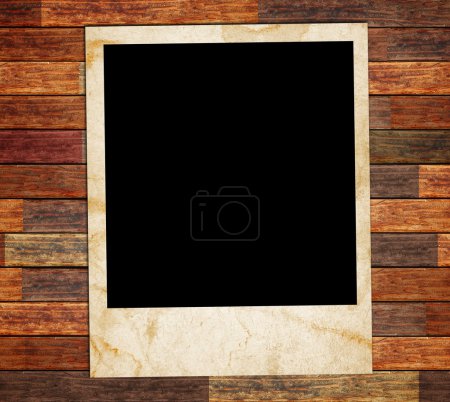 cadre photo sur le fond en bois 